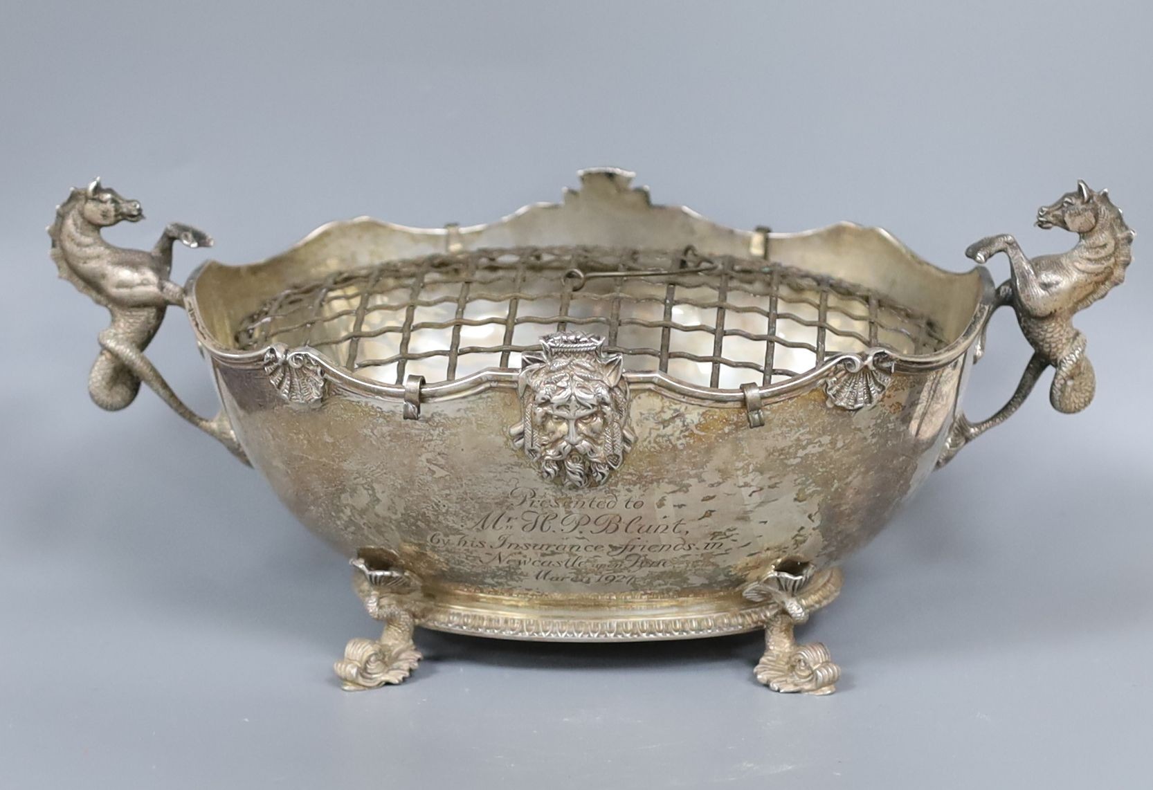 An ornate George V silver two handled oval rose bowl with sea horse handles and dolphin feet, Reid & Sons, London, 1926, 24cm over handles, 15oz.